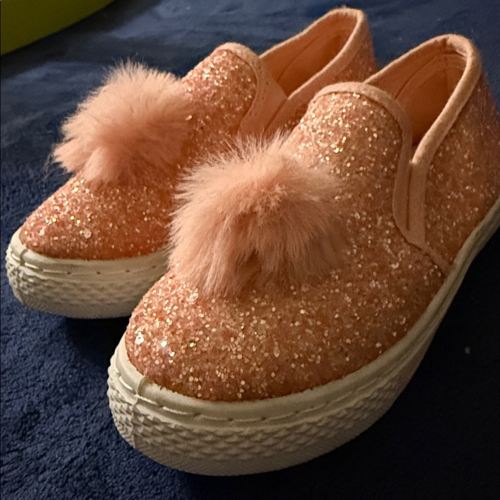 👑 “Pardon My Sparkle” Blush Glitter Slip-Ons w/ Pom Detail (Girls 11)